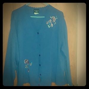 A purple v neck cardigan sweater